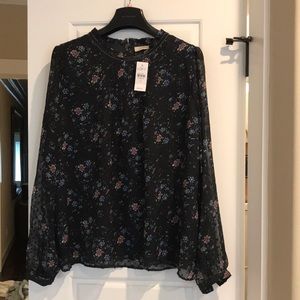 Navy Blouse with flowers.